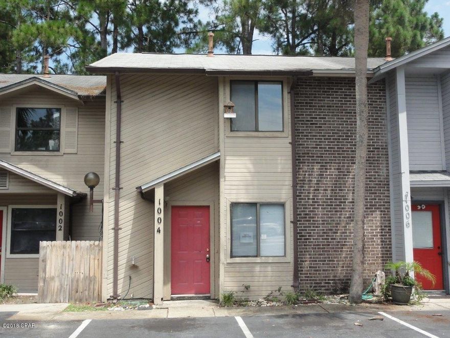 Beautiful, interior unit townhome in Harbour Towne complex! Spacious living room! Separate dining/breakfast area! Kitchen features an abundance of cabinetry, white appliances, and large breakfast bar! Half bath on main! Laundry includes built-in shelving! Two spacious bedrooms and two full bathrooms on upper level! Balcony off master with peaceful view of lake! Rear patio/deck includes hot tub & privacy fence on sides with view of lake as well! A must see! Submit your offer today!