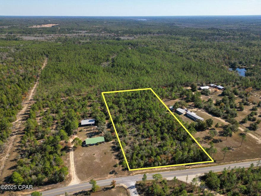 Discover the perfect opportunity to own 3.77 acres of beautiful land with paved road access, ready to be cleared and made your own. This unrestricted property offers endless possibilities—bring your mobile home, build your dream home, or create a private retreat just the way you envision it. 100% Flood Zone X (no flood zone!)

Utilities are well-suited for rural living, with a septic tank and private water well needed. Power lines run along the paved road directly in front of the property, making electrical connection convenient.

Enjoy the peace and privacy of Northwest Florida, known for its slower pace of life, friendly communities, and abundant natural beauty. The property is located in Southern Washington County, near freshwater springs, parks, boat ramps, and water management land, offering endless opportunities for outdoor recreation, yet it's still less than an hour from the beautiful Gulf Coast beaches.

Whether you're looking to develop now or invest for the future, this versatile parcel combines space, location, and freedom with no HOA or deed restrictions. Your chance to enjoy nature, tranquility, and coastal proximity all in one location.

No survey available, buyer to pay owner's title policy and doc stamps.