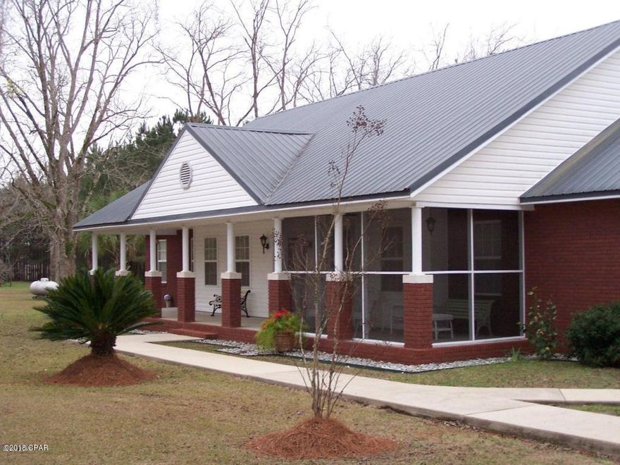 No Storm damage to home. Minimal yard damage.This custom built, very well maintained home, sitting on 25 groomed acres of peace and serenity. With both formal and informal living spaces! Great for a large family or secluded retirement living. Master bedroom features a safe room/walk-in closet . His and Her master bath. Hubby has his very own closet too. 2 large additional bedrooms and office which could easily convert to 4th bedroom. Bring all of your outdoor toys, this property offers a 4 car garage and other out buildings for storage. 22 pecan trees and several acres of mature planted pines, with plenty of room for a garden and farm animals. Don't worry about storms with your all home built in generator.   A short drive to both Marianna and Dothan. Make an appointment today