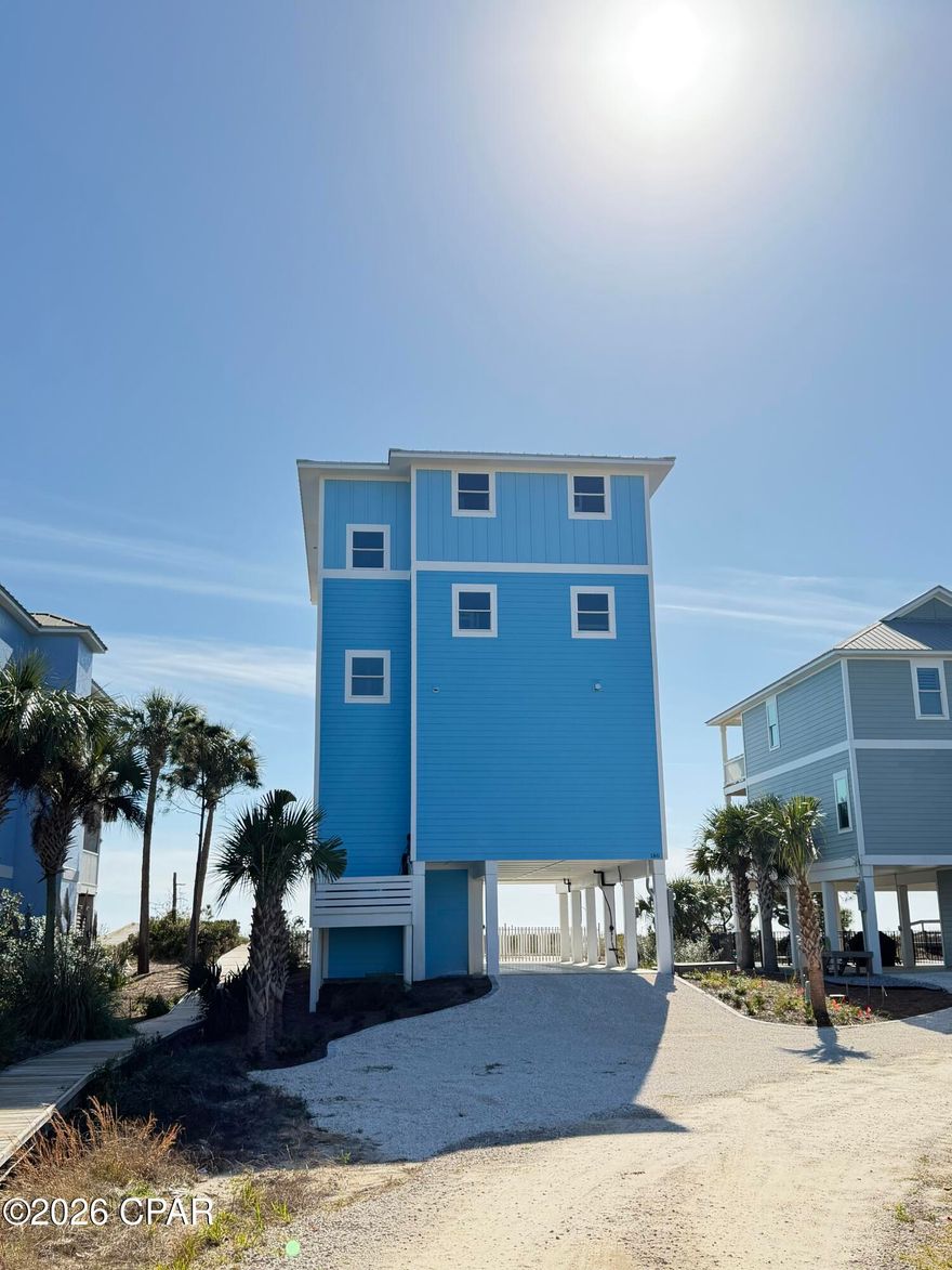 RELAXED LUXURY MEETS GULF-FRONT LIVING!! An exceptional beachfront retreat designed for those who appreciate space, style & sweeping coastal views. Wake up to the rhythmic sound of waves & step directly onto the sugar-white sand from this thoughtfully designed home.  With 6 beautifully appointed bedrooms—all offering stunning ocean views—this residence delivers comfort, privacy & effortless coastal elegance in every direction. The heart of the home is a striking open-concept living space that flows seamlessly into the dining area & expansive deck, creating an ideal setting for entertaining or simply unwinding to salty breezes. The kitchen is a showstopper, featuring double refrigerators, double dishwashers, a beverage cooler, ice maker, oversized island & high-end appliances—perfect for hosting gatherings both big & small. Outdoor living truly shines here. Enjoy a private, fenced heated pool with an attached hot tub & direct access from the ground level for easy relaxation after beach days. The shared boardwalk provides quick beach access. Every detail of this Gulf-front home is designed to elevate coastal living, blending luxury, function & unforgettable views into one remarkable beachside escape. Just minutes away, Cape San Blas offers miles of pristine, pet-friendly beaches perfect for long walks, shelling, paddleboarding, kayaking & unforgettable sunsets over the Gulf. A short drive to the charming town of Port St Joe delivers a vibrant mix of local dining, coastal boutiques, live music, fishing charters, boating on St. Joseph Bay, scenic trails & year-round community events that capture the laid-back charm of Florida's Forgotten Coast. Call for your private tour & LIVE THE BEACH LIFE!  *This listing includes photos that have been digitally altered using virtual staging & AI-generated furnishings. Images are for visualization. Furniture & décor shown are not presently in the property.*