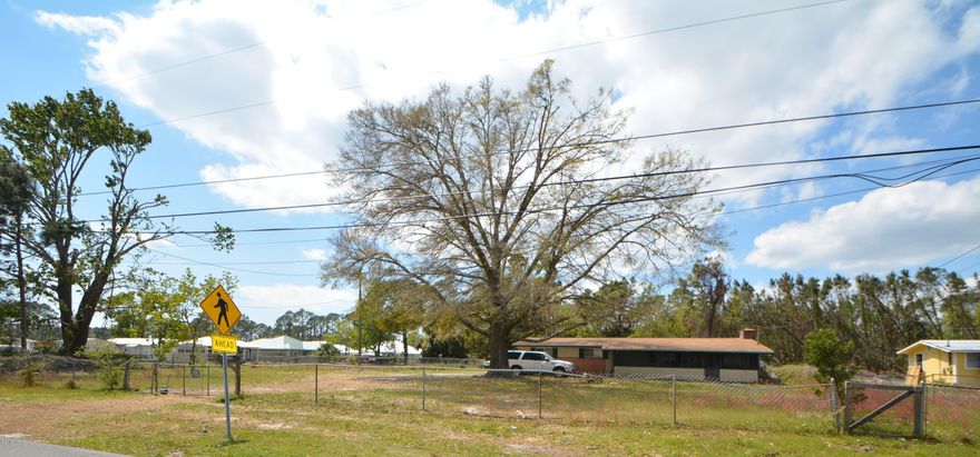 Great investment opportunity. Approx. 0.7 acres of property that can be developed with multiple dwellings. There is currently a 1450 square foot, four bedroom, one and a half bath house on the property that is being rented but the highest and best use for the property would be development of it.  Proposed development plan shows five duplexes (10 units) possible on the lot. There is a pad on the Laird side of the property that used to have a mobile home on it that has been removed.  Buyer to independently verify zoning and density requirements.