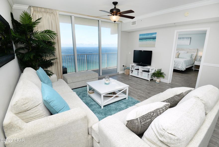 CURRENTLY UNDER CONTRACT, SELLER WILL CONSIDER BACKUP OFFERS -Beautiful updated condo at the highly desired Tidewater Resort with beachfront Master suite and storage room right next to condo.  This is the most popular floor plan in all of Tidewater.  The unit comfortably sleeps 6 guests with a king bed in the bedroom, bunk beds in bunk room, queen sleeper sofa, offers 2 full bathrooms and full sized laundry.  This condo is tastefully decorated with new furniture, wood looking tile flooring throughout and granite countertops.  It's fully furnished and rental ready.  Tidewater is just a half mile west of Pier Park and offers 2 outdoor pools, an indoor pool, tiki bar, full restaurant, fitness room with steam/sauna room, movie theater, convenience store, beach service, gift shop, covered garag