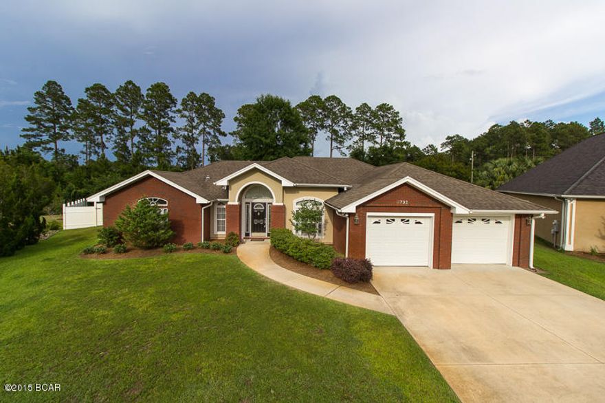 Hammocks Phase 5! This is a custom built all brick home that sits on the largest lot in the hammocks and is located on a cul-de-dac. The 20'x12.6' outdoor covered patio overlooks the pool and huge backyard. The floor plan features a formal living area with a fireplace and is open to the formal dining room. Through a set of french doors is a large kitchen and family room. The kitchen has tons of cabinet and countertop space, beautiful backsplash, and a great size bar area. The family room has huge windows and a lot of natural lighting. Beautiful hardwood floors and large upgraded tile run throughout. The bedrooms are split with an absolutely amazing master suite. Located in one of the best neighborhoods and school districts in Bay County.