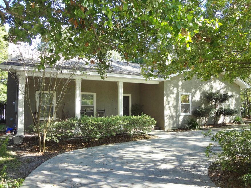 Wonderful Lynn Haven home with a classic country charm. Home has all the upgrades you'd ever wish for, along with a large corner lot & privacy fenced back yard, inground gunite dark speckle finish pool, & large patio area. This 5bedrm , 3bath home is spacious with a functional flowing floor plan. You'll appreciate the craftsmanship of the real wood cabinetry throughout the home. Well appointed kitchen with Corian counter tops that overlooks the Sunroom and pool area.  High 10' ceilings and crown molding accent the spacious feel of the home. Large comfortable living area with a warm fireplace offer a great gathering area for the whole family. There is a Mother in law suite in addition to the 5th bed or private office space. All flooring is tile or wood for easy care. Roof was replaced 2016.