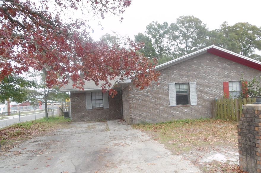 Don't miss this great opportunity to own an all brick, 3 bedroom 2 bath, attached home.  The living room is open to the kitchen and French doors that lead to the huge back yard, which is partially fenced.  Located on a corner lot, this parcel is much larger than is typical with a duplex-style home.  The back yard is accessible from Lake Dr, so there's plenty of room to store a boat, camper, etc. (All info is approximate and ANY important info should be verified by the buyer.)