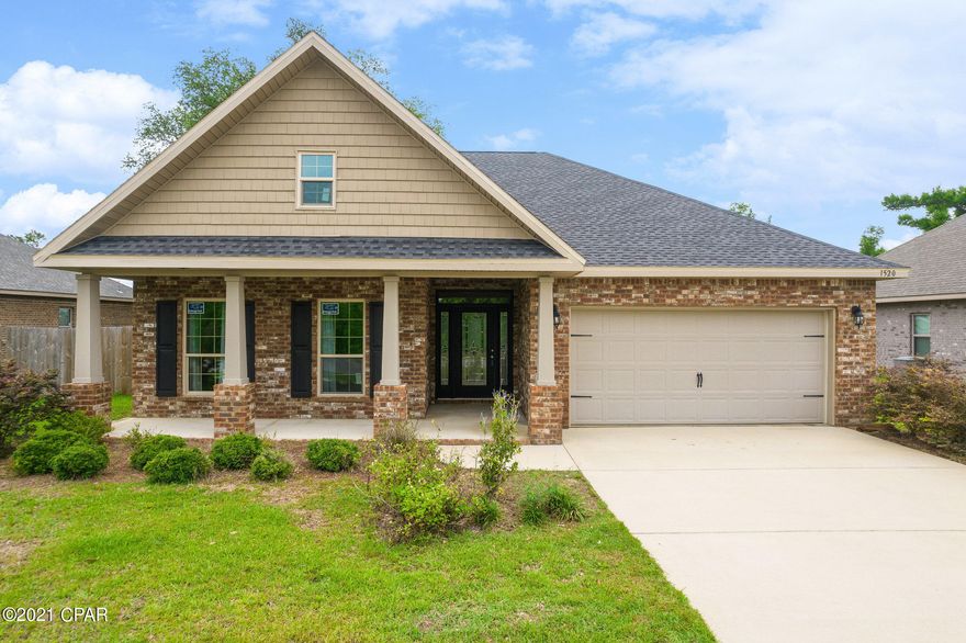 Currently under contract, seller accepting backup offers. 3 bedroom 2 bath 1980 sq. ft. brick home is just what you are looking for; Lynn Haven school district and on a quiet cul-de-sac. The home features an inviting front porch, large enough for a sitting area to sit a watch the amazing Florida sunsets. The large foyer opens to the family room in the center of in the home  featuring a double tray ceiling. The family room is open to the kitchen - wood cabinets, granite counters, and stainless appliances; and the huge dining area- room for an 8 ft table and more. The master bedroom is enormous with enough room for king size bed and a sitting area or office. The master bedroom contains a walk-in closet and the master bath features a double sink vanity, separate shower, garden tub. French doors in the family room lead to the bright and airy sunroom. Off the sunroom is a covered patio- great for outdoor dining and entertaining and the fenced backyard. At the front of the home off the foyer, a hallway leads to the second full bath with a linen closet, second bedroom containing vaulted ceilings and the third bedroom. In addition, there is a laundry room (washer and dryer stay) with access to the 2-car garage. Roof replaced January 2021. All windows replaced May 2021.  Age, Square Footage, lot and room sizes approximate, if important please verify.