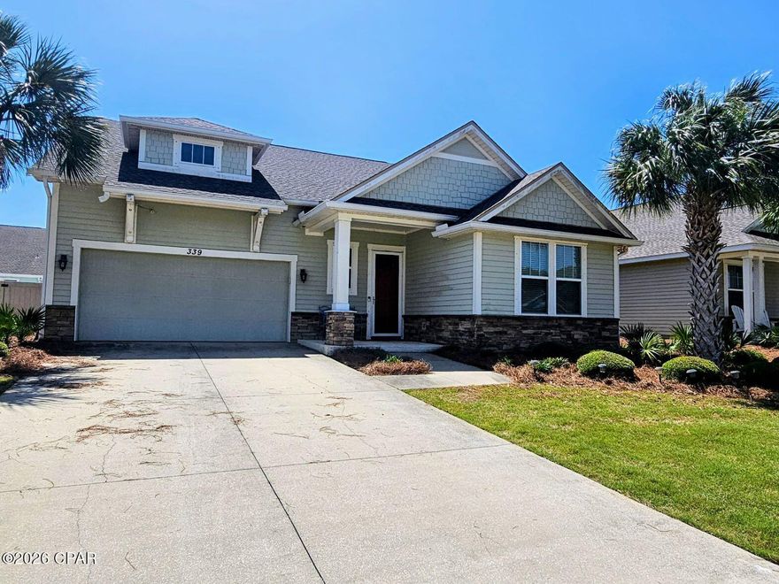 Welcome to Whisper Dunes, Panama City Beaches beautiful neighborhood on the west end.  339 Blue Sage Road is a 5 bedroom, 3 bath home that looks and feels  like a brand new home.   Everyone is looking for that open floor plan and this one doesn't disappoint.    The feel of the home is a craftsman style  with shaker style cabinets and granite counter tops along with stylish crown molding throughout.  the kitchen features a huge island and a generous stainless steel appliance package.   The living room is open to the kitchen for the spacious feel that you expect from a home built for entertaining.   A luxurious master suite features dual vanities, walk in shower, separate soaking tub and large walk in closet.  All of the remaining bedrooms are very large and perfect for those needing the extra space.  The exterior of the home is built to last with hardie board style siding and stone accents.   If you have been looking for great beach living in a private community, close to the water and 30A, this is the ONE. Call today