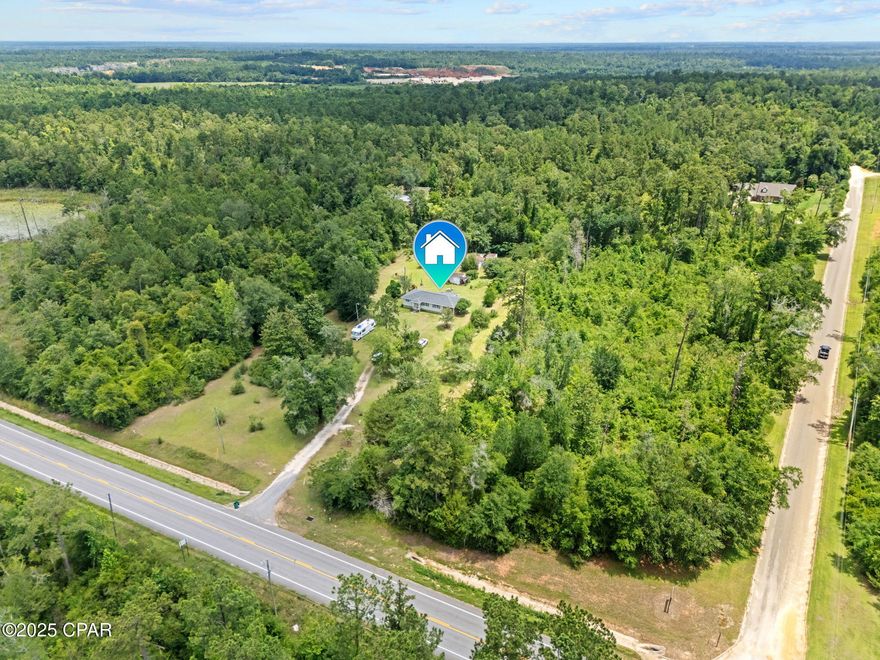 Prime Commercial Opportunity on 2.08 Acres!!  Mixed-Use Zoning in a Growing Corridor!! 

Positioned along FL-73 in Marianna, this 2.08-acre mixed-use property presents an exceptional opportunity for commercial development, investment, or a live/work setup in one of Jackson County's most accessible locations. Zoned for mixed-use, the possibilities here are wide open, from retail, office, and service-based businesses to future development or rental income opportunities. The property includes a well-maintained 3-bedroom, 2-bathroom home that can easily be converted into office space, a storefront, or employee housing. Inside, you'll find spacious common areas including a large living room, formal dining area, and a full kitchen, ideal for adapting to a reception space or break room. The enclosed sunroom offers additional flexibility for a waiting area or private office, while the existing bathrooms and bedrooms provide functionality for staff or client needs. Outside, the expansive 2.08 acre lot features mature trees, a barn for storage or workspace, and ample parking space with a covered carport and long driveway. There's more than enough room to expand or build additional structures, depending on your vision. High visibility and easy access from a main thoroughfare make this location especially attractive for businesses looking to serve the local community or travelers through the area. Just minutes from downtown Marianna, major highways, and area amenities, this property offers the rare blend of space, location, and zoning flexibility at an attractive price point.

Contact a licensed REALTOR® today to explore the commercial potential of this unique property. If important, all measurements, zoning, and intended use should be verified by the buyer.