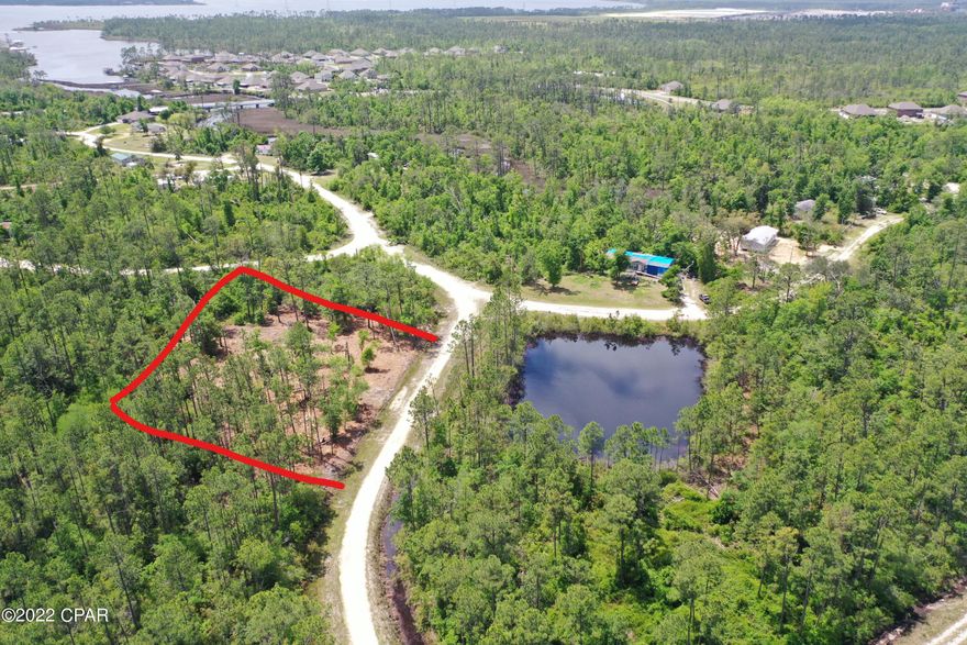 Lot 12 Hickory Bluff, named for the trees and high and dry land, here is a building lot, ready for a new construction or mobile home. Surrounded by new homes and a short distance to Fanning Bayou, fishing, boat ramp and just a few miles from Lynn Haven. The lot has with no association fees so bring your boat, RV, build a pole bar or workshop. Peaceful, quiet and ready to go today! Lot next door is for sale as well or choose from any of the 50 lots we have for sale in Hickory Bluff community! Call for additional details.