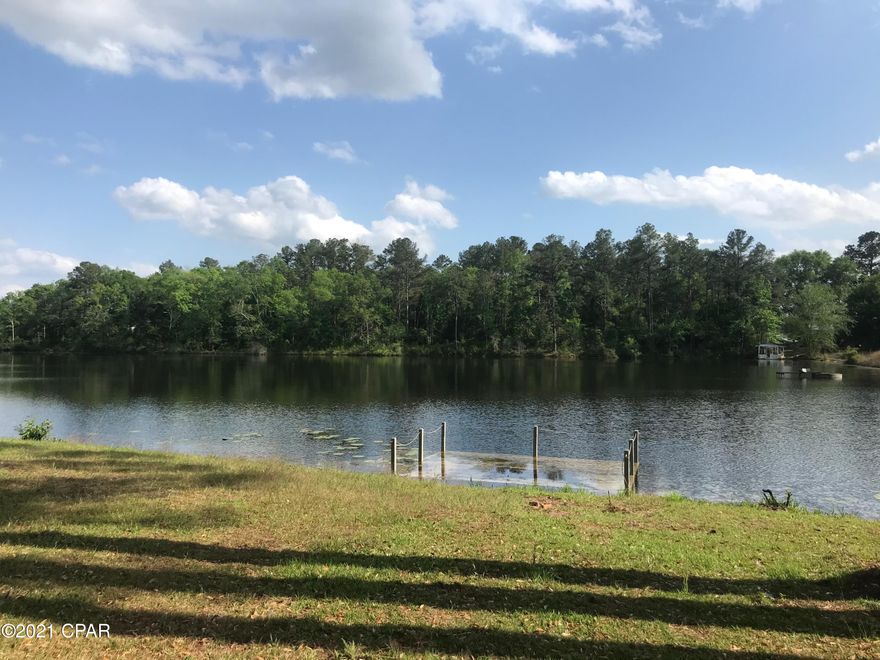 Beautiful lot with 98 feet of lakefront in the sought after Dogwood Lakes Estates subdivision. This lot has oaks, magnolias, and other hardwood trees scattered throughout and gently slopes down towards the lake. The road that leads to lot ends not far past lot and is surfaced with crushed asphalt. Lot is located near the Dogwood Lakes 18 hole golf course and a short drive to Hwy 2 and Hwy 79 and the town of Bonifay, FL. Build your dream home on this rare water front lot and bass fish off of your private dock or jump in your golf cart and head to the course to play a round of golf! Only an hours drive to Panama City Beach to the South and Dothan, Alabama to the Northeast.