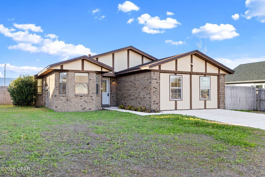 This well-maintained 3-bedroom, 2-bath home offers comfort, functionality, and great indoor-outdoor living. A versatile bonus room, created from a converted garage, adds valuable flex space, perfect for a home office, playroom, gym, or additional living area.

Inside, you'll find new tile flooring throughout and a cozy fireplace that anchors the main living space. The kitchen features updated appliances and flows easily into the dining and living areas, making it ideal for everyday living and entertaining. Each bedroom offers generously sized closets, while the primary suite includes a private ensuite bathroom for added convenience.
Step outside to enjoy a large back deck overlooking a fully privacy-fenced backyard perfect for relaxing, grilling, or hosting gatherings. With thoughtful updates and a functional layout, this home is move-in ready and offers plenty of space both inside and out.

Conveniently located near shopping, dining, schools, and Tyndall Air Force Base, 721 J J Drive is a fantastic opportunity to own a comfortable home in the heart of Panama City. Schedule your showing today!