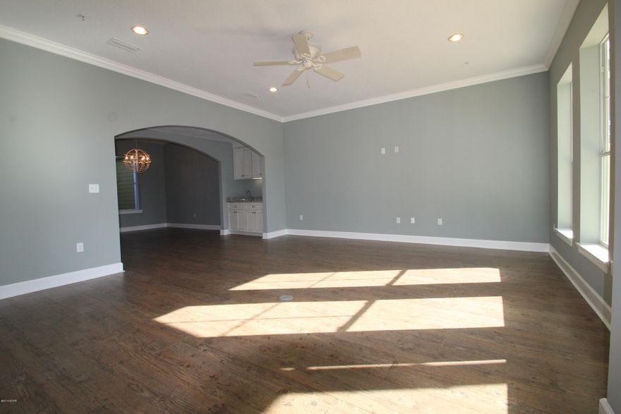 Its like owning a Home without any maintenance. These townhomes have all the same great amenities and luxury that you would expect from an upscale community like Island Reserve. These beautiful two-story townhomes boast 3 bedrooms, 3.5 baths. Every bedroom has its own Bathroom with 2200 square feet of H/C living space. Each townhome has its own double car garage, front and rear entries, first floor patio, and second floor balcony just off the Master Suite. Open concept layout with a large living room equipped with arched openings leading you into the dining room and kitchen. Living room is 20x18 and features a built in wet bar with matching granite countertops, and an owners closet. The kitchen is magnificent and has beautiful granite countertops, custom cabinets, brand new stainless steel appliances, an island with bar seating, and an oversized pantry. The dining room adjacent to the kitchen is large enough for everybody and is lined with windows looking out to your private courtyard, thus allowing plenty of that natural Florida sunlight to shine through when you want it. Down the hall connecting the garage to the kitchen is a good sized laundry room and half bathroom. Upstairs you'll find 3 bedrooms each with their own bathroom, but none more stunning than the Master Bedroom Suite. Master Bedroom is very spacious with a sitting area near the entrance and your own private balcony overlooking the back of the complex. Master bath features a double vanity with granite tops, a big garden tub, separate shower and separate toilet area, as well as an enormous walk-in closet. Down the hall are the other 2 bedrooms both of which have good size and their own full private bathrooms. The Island Reserve complex has just as much to brag about as these townhomes. Throughout the complex you'll notice the beautiful fountains and lush landscaping as you make your way down to the pool, hot tub, or clubhouse area. The pool is perhaps the largest in Bay County with two waterfalls, a zero entry area, and a lap area for those who like to swim after a nice workout. The pool deck is equipped with plenty of tables and chairs for your convenience and there is also a separate restroom facility close to the pool so you don't have to go back to your townhome just to use the bathroom. Next to the pool is a separate Splash Pad area for the kids. Inside the Clubhouse is a heated and cooled indoor basketball court, as well as a state of the art fitness center with free weights and machines. On your way to the clubhouse you might run into one of the many friendly security guards who man this property day and night keeping everything in order. Island Reserve is a great community whether you are single, raising a family, or retired. Everybody is friendly and there is a strong sense of community here. If you want the best here at Island Reserve look no further than these brand new townhomes. These won't last long at this price. Resort Living close to everything in Panama City Beach. Beach is 1.4 miles away or 4-5 minute drive from Island Reserve.