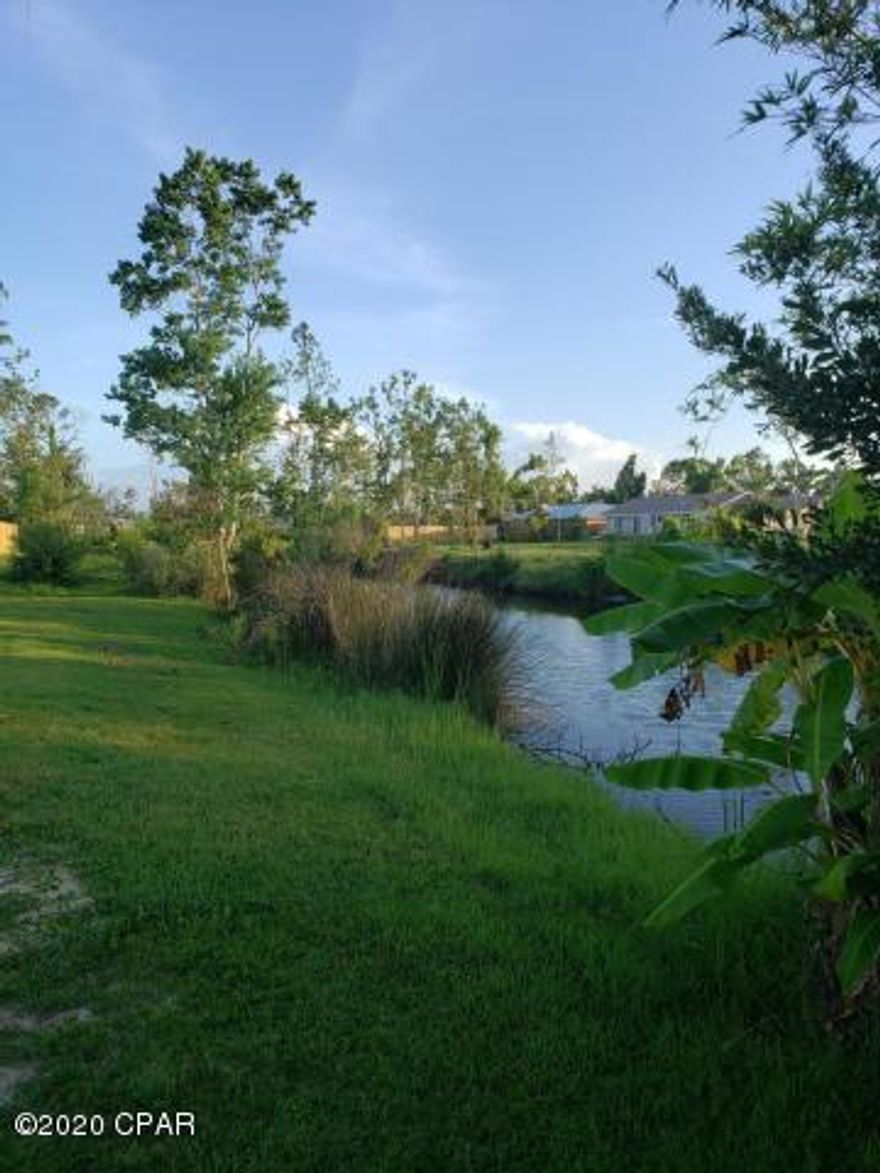 UNDER CONTRACT SELLER TAKING BACK UP OFFER  Level half acre lot that is cleared has a well and ready to build your dream home on.   Desirable Lynn Haven Area.    Enjoy the serenity of the non-navigable canal on the side of the property that offers enjoyment of kayaking, fishing, and watching some of the local wildlife.  Home plans are available and custom builder is available to design your dream home.  Call today.