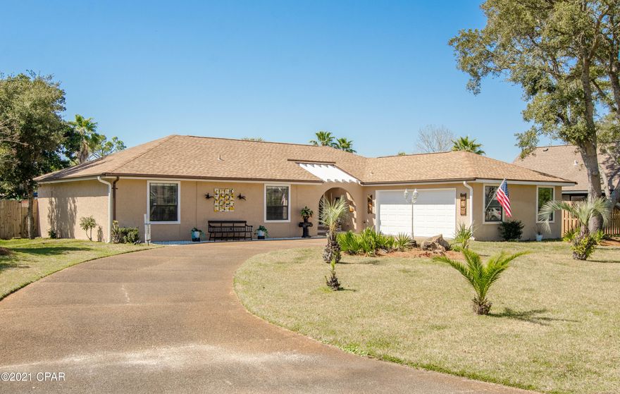 3 BED / 2 BATH HOME WITH A POOL!!! This beautiful and spacious 3 bedroom home in the popular subdivision of Grand Lagoon Shores features a pergola covered entrance and french doors. If you love to entertain, this is the home for you! There is plenty of space inside and outside the home for your guests! The master bedroom has a large nook that can be used as a sitting room/office. The kitchen and dining area includes dining room, breakfast nook and breakfast bar.  Off of the kitchen is a large laundry/pantry room and the garage entrance. There are built in cabinets in the dining room, hallway and bedroom. From the living room and master bedroom, you'll enter the oversized screened lanai which leads to the inground pool. The home sits on a large privacy fenced lot. This home is a must see!!! Grand Lagoon Shores subdivision is close to the beach, bay, restaurants, shopping and the Hathaway Bridge.