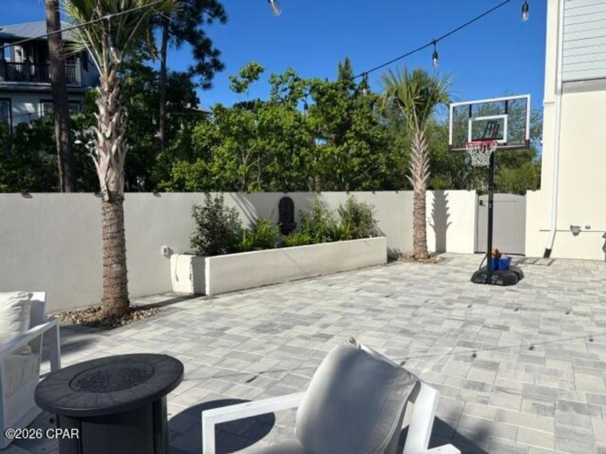 ***3 BEDROOM(WITH HOME OFFICE), 2.5 BATHROOM STUNNING HOME IN THE EXCLUSIVE(AND GATED) MARTINIQUE COMMUNITY!!!*** This absolutely breathtaking 6 year old home has been meticulously maintained by its owners. Exterior features include but are not limited to: Metal roof with cedar shake accents, a brick pavers driveway, first floor stucco walls with stucco parapets and second floor hardie board siding, custom cypress wood garage door, tankless gas water heater, wood deck, tongue and groove front porch ceiling with pecky cypress and tile floors. The screened porch is absolutely beautiful and perfect for relaxing in, and to top it ALL of a $55,000 backyard renovation finalized in 2024 that includes a stucco concrete wall, brick pavers, wood gates and artificial turf. As you step inside the home you are greeted to an open floor concept that offers crown molding, ceiling fans throughout the home and bedrooms, a wood look tile throughout the first floor, wood stairway, spacious loft, second floor luxury vinyl plank flooring, tiled master bathroom with a marble band and marble shower floor, marble tiled guest and half bathrooms and custom closets in all rooms. The living room shell stucco gas fireplace(with a gas ventless insert)is an added touch, perfect for those cool winter nights. Kitchen comes with stainless steel appliances, a gas range, custom pantry, shaker style cabinetry, quartz countertops(throughout home), and a marble backsplash. Spray foam insulation and impact resistant windows throughout. This home will not last long...so call me before it gets away! All information is approximate and should be verified by buyers if important.