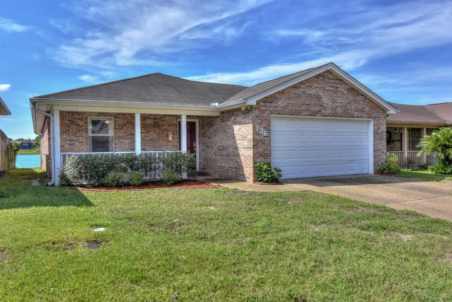 This home is in a peaceful little neighborhood built around Lake Marin. The beautiful water view directly behind this home creates such a tranquil setting with luck in our favor as the home is South facing to keep the sun out of your eyes. Grill on your covered back patio and relax. The all brick home has an open floor plan that maximizes the view. Three bedrooms, 2 bathrooms and a full laundry room make this a comfortable home. There is also an attached 2 car garage.