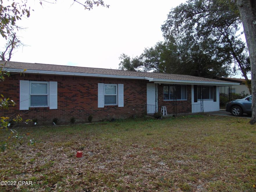 Brick home with  4 bedrooms located close to Shopping, Restaurants, and near Tyndall AFB.   The deep one car garage was fully enclosed with heating and cooling and is currently a 4th bedroom.  This large bonus room can be a game room or large office.  Open floor plan with kitchen overlooking the dinning and living room area.  All ceramic tile throughout (no carpet). New roof installed after Hurricane Michael. Extra driveway on side of home for boat etc. Rare home under $200,000 in the East side area.