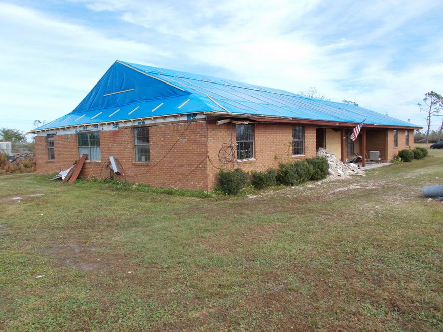 This Home  is one of many that suffered damage with Hurricane Michael.

Owner has decided to sell AS-IS

and not to re-build.

This is a huge parcel over 2 acres with the home that needs much work, but has a 2 bed 1 bath cottage (900 sq ft) that the seller

is currently living in. Just think you could live here while the house is rebuilt then move to the big house and rent the cottage. The Red Storage Building does Not CONVEY