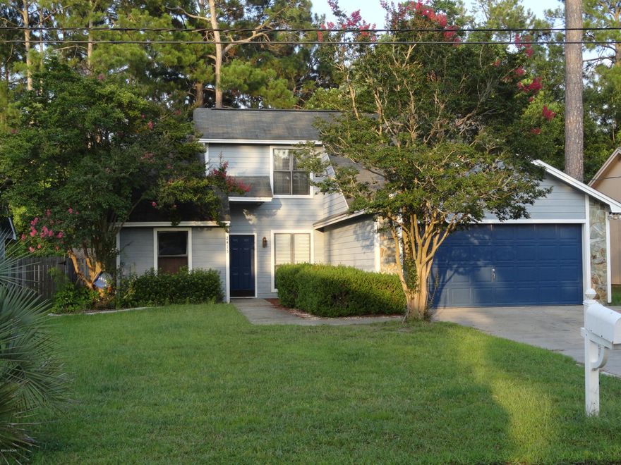 Don't miss this affordable house in Lynn Haven! Belaire Estates is a great family neighborhood in a top school district that is close to shopping and schools.  This 3 bedroom 2 bath house has a newly remodeled kitchen, large heated/cooled Florida room with a custom bar, wood burning fireplace, vaulted ceiling and extended driveway.  Downstairs are two bedrooms and a guest bathroom.  Upstairs consists solely of the master bedroom and bath. The backyard is good sized and gives the feeling of privacy.  There is a also a shed in the fenced in yard along with a separately fenced dog run. The roof is 9 years old and the A/C is about the same. The water heater is 2 years old.  There is a termite bond in place with Terminix.  The sellers loved their home and neighbors.  Come see this one today The backyard has fruit trees for your enjoyment: lemon, lime, and orange.  Additionally there is an irrigation well for your sprinkler system to run off of saving you money.  This house has so many benefits!  Note that the sellers used the area in front of the breakfast bar for their dining table.  A dining table could also be put in the Florida room as well.  Washer and Dryer hookups are located in the garage.