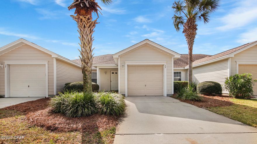 CURRENTLY UNDER CONTRACT, SELLER WILL CONSIDER BACKUP OFFERS Beautifully updated townhome in popular Palmetto Trace. Furniture negatable! This unit backs up to a nice pond & has a open patio. Updates include laminate flooring in living room/bedrooms, newer stainless steel dishwasher, microwave, refrigerator & AC (2021). The living room is spacious & there's plenty of room for bigger furniture. You'll love the huge kitchen w/an abundance of cabinetry & breakfast bar. The main bedroom features an attached full bathroom w/TWO walk-in closets & double sinks. The second bedroom features a nice size closet & is close to the guest full bathroom. You'll appreciate the space in this townhouse, the open floor plan & high ceilings! The community has two pools, is golf cart friendly.