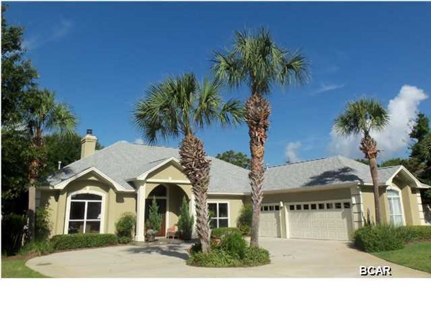 REDUCED! Situated on one of Bay Point's largest and most appealing golf course lots, rarely will you find a truly magnificent setting such as this. Driving down the long driveway to this meticulously maintained home, you will find over 3000 square feet of custom design. Beautiful dramatic front doors as you enter the foyer you walk into the living room to enjoy the most beautiful open view all glass doors looking onto the screened porch, inviting swimming pool and green grass as far as you can see. There is fresh paint throughout the home and large open living room. You will find 4 Bedrooms, 3 Baths and a large living room with a gas fireplace with a split bedroom floor plan. This home has a great kitchen with breakfast bar and was renovated with new appliances and granite countertops. There is a breakfast area overlooking the back yard and swimming pool and a custom desk with built-in shelves for a work station for your computer. The fourth bedroom can also be used as an office separate dining room, very large master suite (20X19) with large master bath with double vanities and his and her closets. This home also has hardwood, carpet and sandstone and quartzite flooring imported from India. Enjoy afternoons on your screened in porch with retractable awnings. The in-ground pool is surrounded by a fenced in yard and the lot is situated overlooking the 14th fairway of the Jack Nicklaus golf course. There is a large workshop with separate A/C, an outdoor shower for your quick convenience, and a three car garage. The lush massive front and back yard has been beautifully landscaped. Embrace the Florida life style you have dreamed about while living in a lovely gated community offering privacy and 24 hour security. Age, SF, lot and room sizes are approximate. Please verify if important.