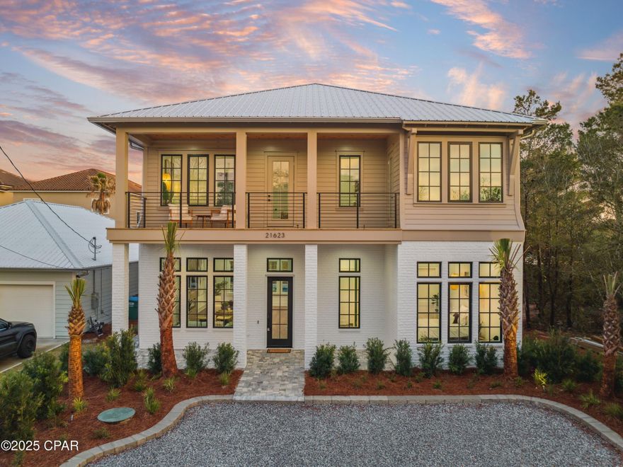 Welcome to 21623 Dolphin Avenue, a brand-new coastal masterpiece perfectly positioned on the coveted west end of Panama City Beach. This stunning new construction residence offers an unparalleled blend of luxury, craftsmanship, and prime location—just a five-minute stroll (0.25 miles) to pristine white-sand beaches and steps from convenient beach access. Spanning 3,363 square feet of thoughtfully designed living space, this five-bedroom, five-bathroom home is crafted to deliver both sophistication and comfort. Soaring 12-foot ceilings on the main level and 10-foot ceilings upstairs create an expansive, airy ambiance, while large impact-rated windows and doors flood the interiors with natural light and ensure long-term durability. Engineered for efficiency and resilience, the home features 2x6 construction, R-19 insulation, and a spray-foamed roof deck, offering superior energy savings and year-round comfort.

Luxury is in every detail, from the 8-foot solid wood interior doors to the premium luxury vinyl plank flooring, solid maple staircase, and exquisite Carrera marble tile. The chef's kitchen is designed for both entertaining and function, boasting natural stone countertops and high-end appliances, including a 36" natural gas range, a 48" refrigerator, dual dishwashers, a drawer microwave, and a powerful 700 CFM hood. Custom-built wooden shelving in each closet adds an extra touch of sophistication.

The outdoor oasis is an entertainer's dream, featuring a fully-equipped summer kitchen with a built-in natural gas grill, an ice maker, and a sinkperfect for al fresco dining. A heated saltwater pool, an outdoor shower, and lush, maintenance-free landscaping with a privacy fence create an exclusive retreat for relaxation and entertainment.

Nestled in one of Panama City Beach's most sought-after locations, this exquisite home offers effortless access to the area's best beaches, premier shopping, and world-class dining. Pier Park, known for its vibrant mix of boutiques, restaurants, and entertainment, is just minutes away, while the charm and sophistication of Rosemary Beach and Scenic 30A are within easy reach. With no HOA restrictions, this exceptional property allows for true ownership freedom in one of the Gulf Coast's most coveted enclaves.

In addition to its luxurious features and prime location, this property boasts a projected rental income of $150,000 to $160,000, making it an outstanding investment opportunity.

Don't miss this rare opportunity to own a brand-new coastal sanctuary steps from the Gulf. Contact us today to learn more and secure your place in paradise!