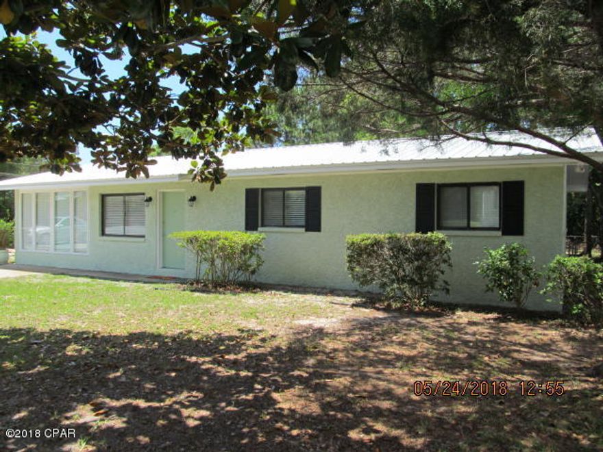 This home needs a new family! Fresh paint in and out, new roof 2018! There is a living room as well as another open space to use as you wish maybe a sitting room...Separate dining room, laundry room, 2 full baths, breakfast bar, and a great large yard! Rear yard is fenced and has a storage shed and covered deck. Located at quiet west end of beach. Walking distance to Lake Powell dock, boat ramp and park. Close to the beach, 30A corridor, pier park and the airport! In an area where there are new homes being built on much smaller lots. Close to Winn-Dixie, Publix and much more. Great family neighborhood. Seller is a FL Licensed Real Estate Broker