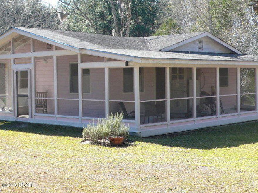 This home has had many renovations, and is in a country setting it has had a new kitchen, new paint, wood floors, the walls have been taken back to the original wood stained walls, a large screened porch with a 22x44 workshop that has electric and heat and air,double doors on one end, this is really a nice workshop, the property has a current survey on it and has lots of natural woods and a small wet area on the back. This is a great starter home or for someone retiring to the country, call agent to show this home today.