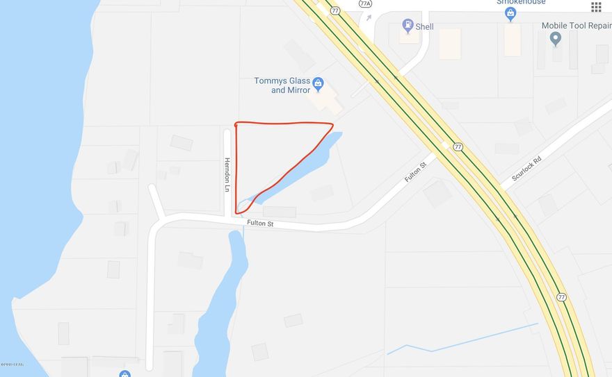 This 1/2 acre parcel is perfect for a new house or mobile home. Country living in a quiet setting and close to Panama City and beaches. Water view of North Bay. Paved county roads on two sides.