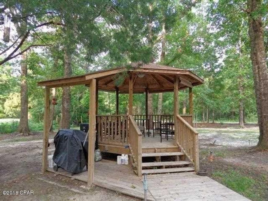 Excellent lot to Build your dream home on.  This lot has privacy but has quick access to Interstate 10 and US 231.  Lot includes a very well built gazebo to sit and enjoy the pleasant surroundings.  Property has fully functional well and power pole.