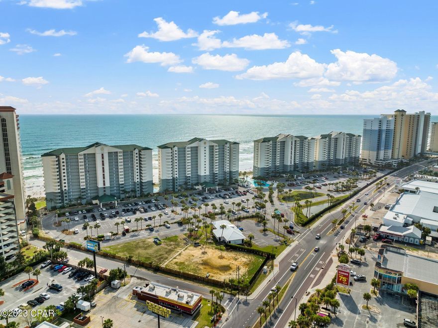 Discover this incredible deal on a gorgeously furnished Gulf-front condominium! With 425 square feet of space, this updated efficiency condo is uniquely situated in an exclusive corner unit within the development.  With good ROI potential at this price.  Revel in floor-to-ceiling Gulf views from the private balcony, offering a breath of fresh saltwater air after a day at the beach. The unit boasts custom-built bunk beds and updated furnishings. It's turnkey and ready for rentals. This unit features tile throughout ensuring easy cleanup and minimal maintenance. The fully functional kitchenette features an electric cooktop, microwave, and fridge. Additionally, there's a separate laundry room with a full-size washer and dryer, along with added storage space. Long Beach's prime location, expansive beach, gated entry, and exceptional on-site amenities make it a one-of-a-kind resort in Panama City Beach. Don't let this distinctive opportunity pass you by!