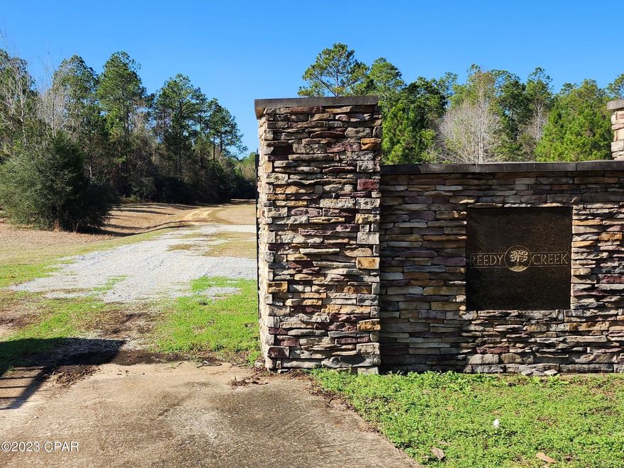 Motivated seller - priced to sell quickly! Beautiful 5.68 acre cul-de-sac lot in the Reedy Creek subdivision. The perfect homesite or investment property. Most of the surrounding lots are vacant and do not have homes on them, which makes for a secluded area with plenty of woods and wildlife. Reedy Creek has some restrictions and a low annual HOA fee that maintains the roads. Each lot has underground electric running to the corner of the property. Only about a half hour drive to Walmart and an hour to Panama City Beach and ECP Airport. It's an excellent getaway spot that isn't too far from the beach! Buyer to verify all pertinent details.