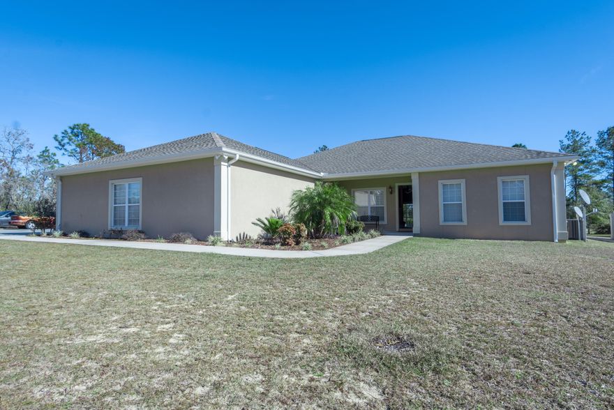 This open floor plan home is hidden gem! The home is built solid block construction stucco finish, blowin in insulation.10 ft ceiling throughout,50 year shingles. Along with the 2 car attached garage, property features 31x33 detached double garage with workshop area. The yard features a beautiful pool (new pump, valves, sand filter and Gunite refinish 2017) screen porch, and the home sits adjacent to the 2nd hole of the Sunny Hills Golf Course sits on 2 lots .  The living area is open and features a formal dining area!  The master bedroom is large and with a nice walk in closet.  The master bath is an oasis featuring a garden tub and tile shower!  This home is a MUST SEE!