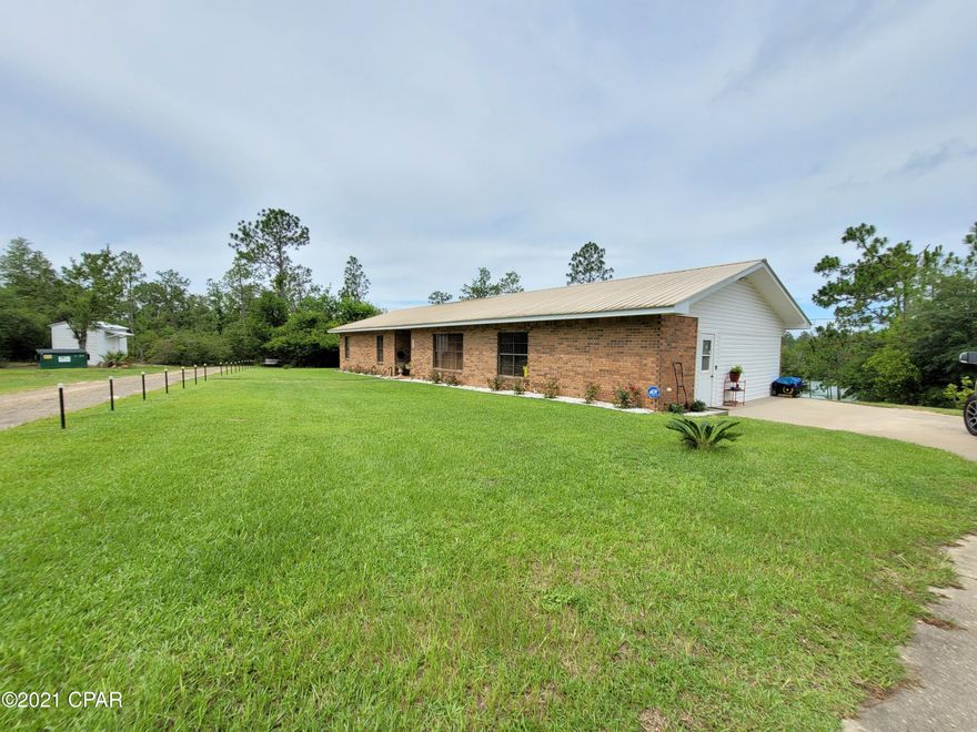 If you are searching for peace and tranquility, this is it! This 3/2 brick home is set in the middle of almost 7 acres on a gorgeous spring fed, private pond in Compass Lake in the Hills. In addition to the home there are multiple out buildings including one at the pond, great for storing all of your water toys! The Florida room has a hot tub to enjoy while looking out over the beautifully landscaped yard and blue water. This place is not going to last long!!!