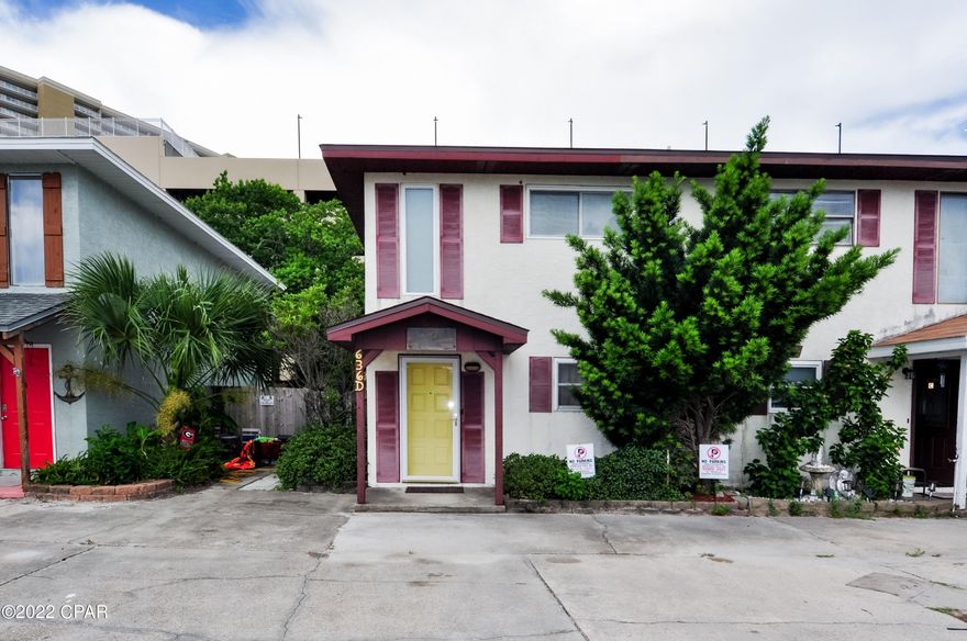 Literally just steps from the beach is where you'll find this 2BR/1.5BA townhome!  This is an end unit in a complex with NO HOA fees and short-term rentals allowed.  Great investment property or use it for your own weekend retreat!  The first floor has tile flooring and there is a large balcony off the master bedroom on the second floor.  You'll love the privacy-fenced backyard with no grass, storage shed, and a large storage closet where you can store all your beach gear.  The beach is just one block away and you're walking distance to several restaurants, stores, and Pier Park is just a 10 minutes drive to the west.   It's time for your own ''Home-Away-From-Home''!  All info is approx and must be verified by BUYERS if important.