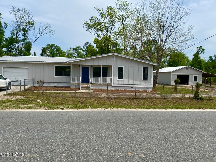 NEWLY REMODELED 3/2 on the most eastern side of Marianna!!  This is an amazing home with a 36 x20 shop, (working 1/2 bath included) attached 36 x 12 lean-to, a nice 12 x 15 pump house with concrete flooring, roll up door and big enough to fit a side by side! It has an attached garage, screened porch and an open patio. Gorgeous new LVP flooring and new carpet in the bedrooms. All new electrical and plumbing fixtures. Grass seed has been planted so expect to see some green sprouts in the yard shortly! Make an appointment today! It will go fast.