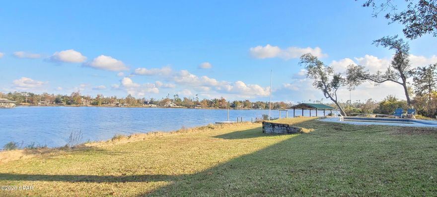 What an opportunity to own a home on Deerpoint Lake!! This 3 bedroom 2 Bath home with 2042 sq sits on 1 acre at the end of a cul de sac street with a Gorgeous 220 foot view of Deerpoint Lake!! Every room in the house has a beautiful view!!! The home has a formal living room and family room, open kitchen with breakfast bar. Granite countertops with oak finished cabinets. The formal living room has built in bookshelves and a wood burning fireplace!! Tile flooring in all of the main living areas. The exterior of the home has rose bushes, fig trees, large oak & maple trees. There is an oversized 3 car garage with a workshop and separate storage room.  The property also features a concrete boat ramp, seawall, 12 x 24 gazebo with electricity & a concrete floor. There is even a large 24 x 24 pole barn with room for a boat and RV. Enjoy a morning cup of coffee on the dock or try your hand at catching some fish for dinner. There is NO HOA payment, but flood insurance will be required.  Dont let this opportunity to slip you by! This home will NOT last long on the market!!