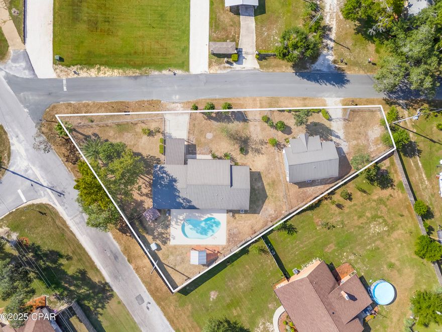 These homes feature recently renovated open-concept kitchen with stainless steel appliances and solid surface counters. The main home includes three bedrooms, two bathrooms, and a spacious bonus room. The secondary home offers two bedrooms and a recently updated bathroom. The main home also boasts a backyard pool and pavilion area, with both homes secured by fencing for privacy.

Both properties share a septic system and well, which has a newly installed filtering system. The metal roofs on both homes are less than seven years old. This beautiful property is located within a half-mile of Deerpoint Park and Boat Ramp.