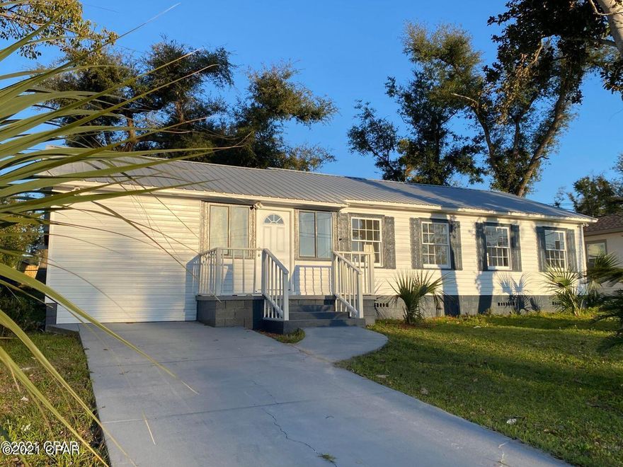 Charm and character abound in this remodeled cute Cove home close to historic St Andrews for many fine restaurants, shops and marina.

This home is nicely remodeled featuring a large open kitchen with granite counters, easily cleaned cabinets, also offers 3 bedrooms plus a bonus room which would make an excellent nursery or office, 2 full baths, large fenced yard and a huge storage or bonus room or convert back into a garage again.