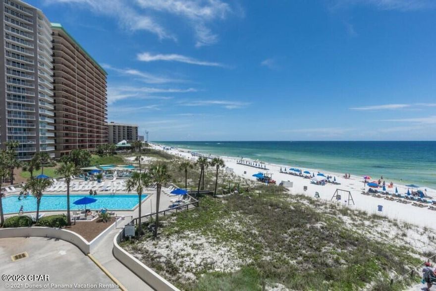 Rarely available in the ''D'' Building...The Perfect Beach Condo with Forever views of the Gulf at this tropical Resort. This Condo was completely renovated in 2022. Upgrades include Kitchen, New Flooring, Granite in both Kitchen & Bathrooms, New W/D, & New Glass & Sliding Doors across the Gulf side. The HVAC is about 4 years old & the condo is nicely furnished. This Condo is turn key ready & Already popular on the on-site rental program, it netted over $38,000 in 2022. Dunes of Panama gated resort features 1500' of Gulf & Beach with 3 Pools, Tennis, Gym , Seasonal Tiki Bar & is pet friendly.  This condo is in great condition & is located in a  very popular complex. It is ready for the next family to enjoy.(AGE,SF APPROX.)