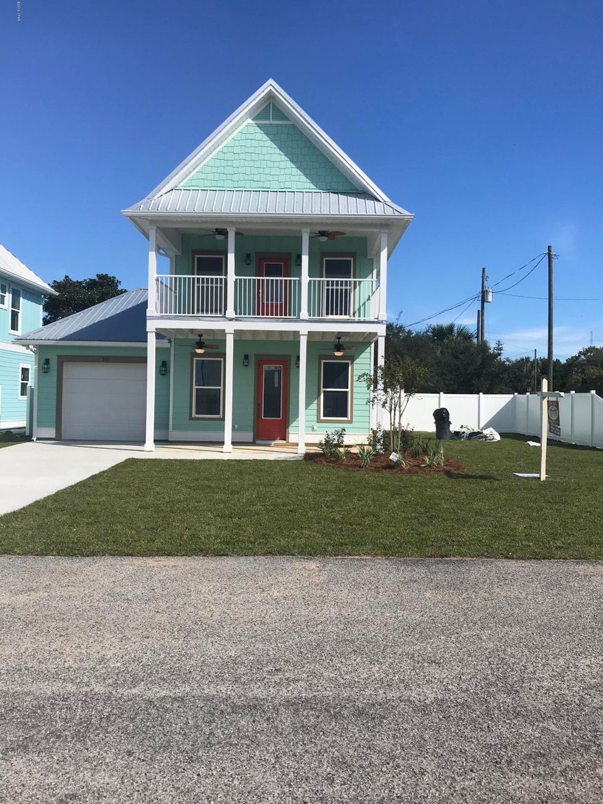 Brand new Beach house! This 2 story beauty is waiting for You. From the second floor balcony, you havelake and Gulf views. Shiplap walls adorn the den and master bedroom.Tile baths. Huge kitchen, with an oversized granite top island. Above grade waterproof vinyl plank flooring. Custom built wood cabinets and vanities. 10 foot ceilings. High wind impact windows & 8 foot doors throughout. Extra large Garage for vehicle, golf carts, and plenty of storage. Outside private shower with hot & cold water.Beautiful landscaping with a white vinyl fence.Irrigation system to nourish the outdoor plants and grass. And look next door to see the fraternal twin of this house. Don't miss out on this great beach home.