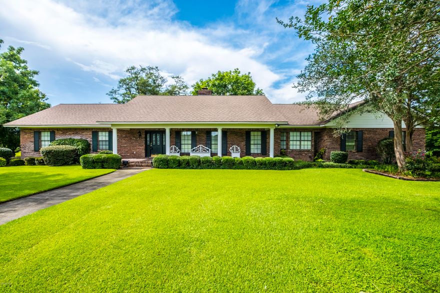 Country Executive Estate! 4 Acres of Country Living with the convenience of Town less than 2 miles away. This home is beautifully located a to a hill with wonderful outdoor landscaping complimenting the drive way structure. The Home features several viewing porches and offers spacious gathering rooms for the large Family events. Come and tour the OVERSIZED Eat In Kitchen with adjoining formal spaces and the OVERSIZED Den. This has has been extremely well maintained and is MOVE IN READY!