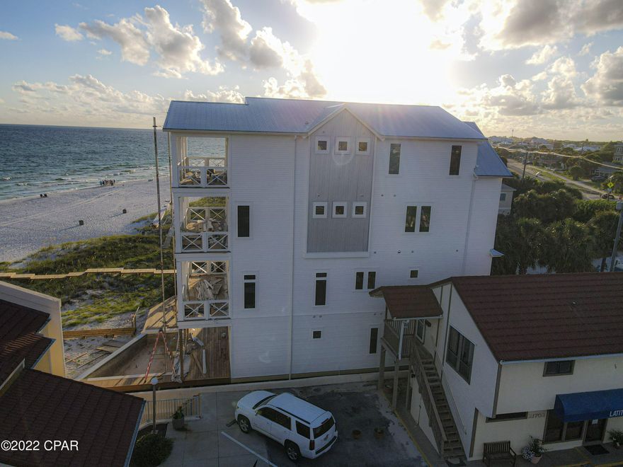 Largest new Beach House on Front Beach Road and close to 30A on PCB West End. THE HOUSE IS NOW FINISHED, PROFESSIONAL PHOTOS COMING THIS WEEK!   This custom-built Beach House is the best designed for the luxury Buyer that wants an investment that will be a cash cow.  Fantastic views with a 60' gulf front lot and fully furnished ready for rental.  See rental projections that are based off similar homes built by same developer with income over 650K per year. This house sleeps, over 40 with 4 bedrooms and 5 bunk rooms.  Bunk house bunk room on 4th Floor with oversize Rec Room. The Master on the third floor has a Wet Bar and as well as the second master on third floor.