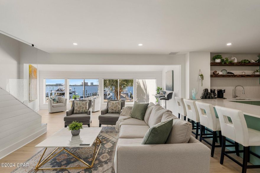 Discover this freshly renovated second-floor harbor villa unit with marina views, nestled within the exclusive Bay Point community. Enjoy water views from the living room of this beautifully renovated condo, which features amazing upgrades, including LVP flooring throughout, granite countertops, recessed lighting, tile showers, shiplap walls, wooden floating kitchen shelves, and sleeping accommodations for six. Convenience is at your fingertips with a fully equipped kitchen, stacked washer and dryer, owner's closet, and furnished interiors, making it an excellent investment for short-term or long-term rentals. Tucked securely within Bay Point's gated community, you'll experience a range of top-notch amenities, including 24-hour roving security, a prestigious golf club featuring the exclusive Nicklaus Golf Course (the only one of its kind in Northwest Florida), Point South Marina, a state-of-the-art full-service marina with a fuel dock and slips accommodating boats up to 120 feet, five HydroGrid Clay tennis courts, and an on-site USPS post office