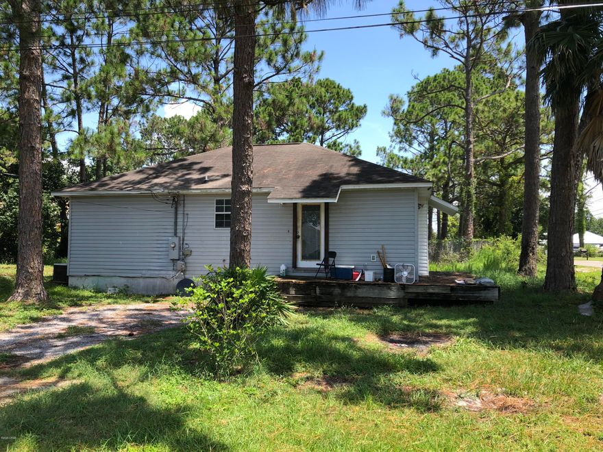 This is a large lot  with a fixer-upper 2/2 Cottage, and 2 septic tanks, 2 storage sheds, 2 driveways.  Please use caution when viewing property.  New construction to the East and South of this property.  County Zoning R-2, No mobile homes.