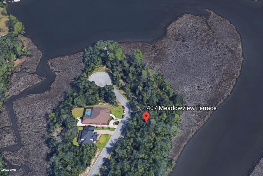 Waterfront .40 acre lot in The Meadows & The Point subdivision located on a cul-de-sac. This lot offers privacy and tranquility! Perfect for building a waterfront home and taking advantage of the nearby golf course. Lot offers mature oaks along with existing spectacular wooded area. All measurements, sizes and other listing information should be verified if deemed important.