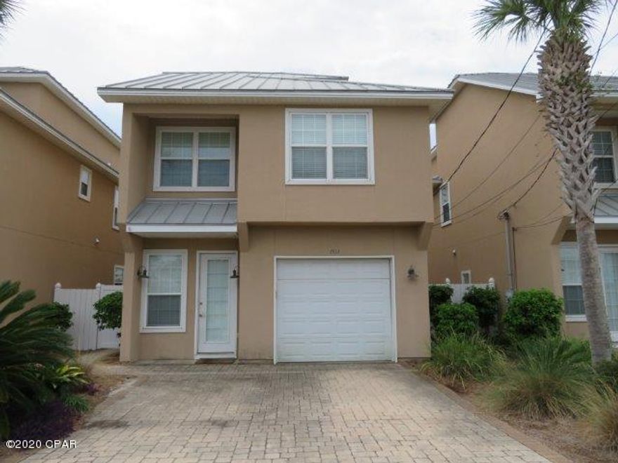 Beautiful home in the Villas of Panama! Covered front stoop! Open floor plan through living, dining, & kitchen! Kitchen features stained cabinets, stone counters, SS appliances, & island! Double French doors provide natural lighting & lead to back patio! Half bath on the main level! Second level features three bedrooms and two full bathrooms! One bedroom has a walk-in closet & deck access! Top level features fourth bedroom with a full bathroom & private balcony! Walking distance to the beach or relax at the community pool! A must see! Submit your offer today!