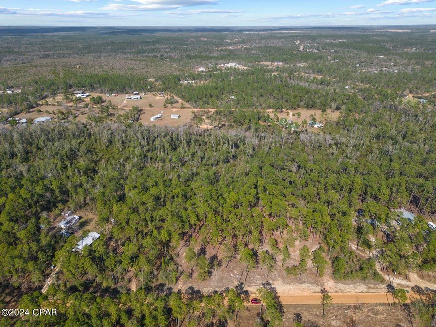 **DRONE FOOTAGE COMING SOON** Just over 6 acres, this lot is partially cleared and ready to build your dream home. Sellers have mulched 2.5 prime acres for your future homestead with plenty left untouched. Convenient distance to Chipley, I-10, and about an hour from the white sandy beaches!

3 power poles in front of property to pull off of, septic and well needed. Elevation certificate has been completed and BFE has been set. Ready to build or put a mobile home on NOW.