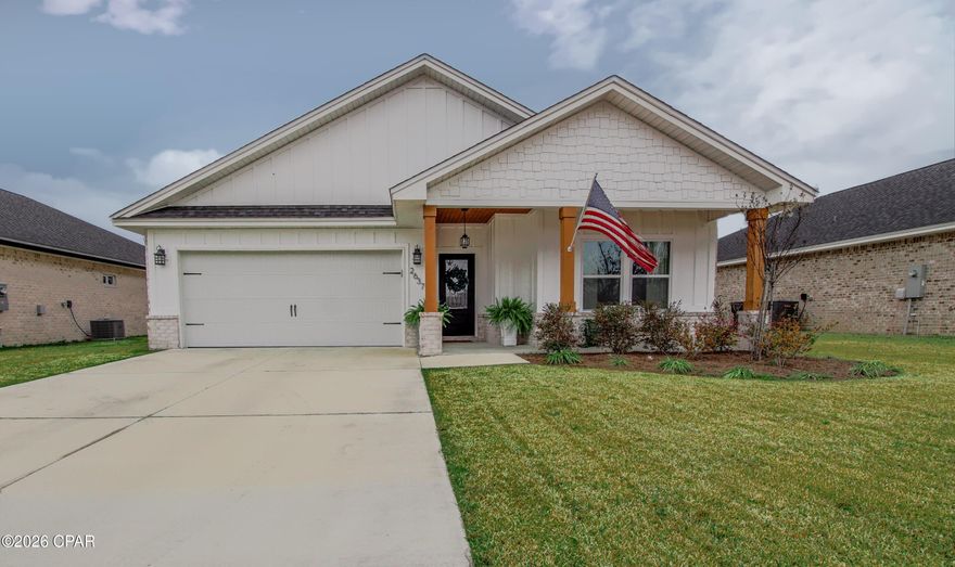 OPEN HOUSE: 2/21 & 2/22 10AM-1PM. Welcome to this stunning, like-new luxury home crafted by one of Bay County's premier builders, showcasing a level of quality and craftsmanship you simply won't find in comparable homes. Ideally located in a quiet cul-de-sac with an unobstructed pond view, this exceptional property combines modern elegance with thoughtful design and superior construction, offering both privacy and beautiful natural scenery. Here, modern elegance meets intentional design and enduring quality. Designed for both everyday comfort and elevated living, this beautifully designed residence showcases upscale finishes, an open-concept layout, and timeless architectural details throughout. Step inside to discover a spacious, light-filled floor plan featuring 9-foot ceilings throughout and a dramatic 10-foot tray ceiling in the living room, creating an expansive and inviting atmosphere. The heart of the home is the designer kitchen, a true chef's dream, complete with a large center island ideal for entertaining, ceiling-height custom wood cabinetry, quartz countertop, farmhouse sink, designer backsplash, walk-in pantry, and a premium stainless steel appliances. The seamless flow between the great room, dining area, and kitchen is enhanced by elegant crown molding, modern LED recessed lighting, and stylish fixtures, making this space perfect for hosting or relaxing in comfort.
Retreat to the private primary suite featuring its own tray ceiling for added architectural interest, along with a beautiful barn door entrance leading into a spa-inspired bathroom. The primary bath includes a cultured marble double vanity, 5-foot garden tub with cultured marble trim, separate cultured marble shower with bench and sleek custom glass door, and a spacious walk-in closet designed for optimal storage. Throughout the home, upgraded luxury vinyl plank flooring adds durability and modern sophistication, complemented by premium hardware, designer lighting, and ceiling fans. The exterior impresses with approximately 90% brick construction combined with board-and-batten Hardie board accents, delivering both curb appeal and lasting durability. The epoxy-coated two-car garage adds a polished touch and features convenient keypad entry, along with pre-wiring for an electric vehicle charging station. The fully sodded and landscaped yard includes an irrigation system on a separate meter for efficiency, while a 6-foot privacy fence with gated access on both sides of the home enhances both security and functionality.
Enjoy outdoor living on the covered back porch, accessed through double doors from the great room, the perfect setting for entertaining, relaxing, or enjoying Florida evenings. Ideally located near local shopping, dining, and restaurants, this home offers convenient access to everyday amenities while remaining less than 20 minutes from Tyndall Air Force Base and the emerald waters and sugar-white beaches of Panama City Beach.
This exceptional home offers the perfect blend of luxury, functionality, and modern design, truly move-in ready and built to impress.