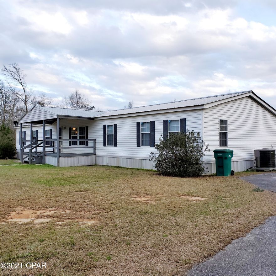 'CURRENTLY UNDER CONTRACT, SELLER ACCEPTING BACKUP OFFERS' 4 Bedroom Home on 7 Acres!  Only minutes to Holmes Creek Landing and Panama City Beach! This home has 5 yr metal roof and newer HVAC.  The Kitchen has been remodeled to make it even more open with lots of space. Home has new flooring and has been painted. Enjoy your large covered front porch AND a large covered deck on the back.  Lots of deer and wildlife all around.  Plenty of space for your garden, horse or chickens.  This home is on a paved road and not far from the town of Vernon.  Great schools and not far to Panama City Beach and Panama City International Air Port. If you want to leave the large city - this home is for you.  Can be divided if you have family who want to live next to you.